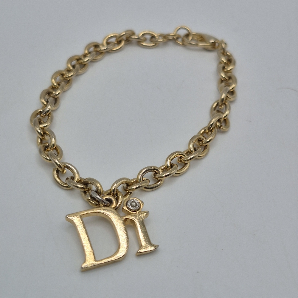 Diamond's Internationall -Gold Tone Chain Bracelet with Charm "Di".   7 Inch